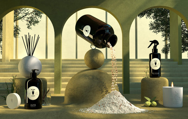 3D illustrated scene depicts surreal, oversized Bois Sauvage apothecary products- lotion, room spray, bath salt and fragrance diffuser