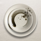 Summi Dinnerware Stacked on linen
