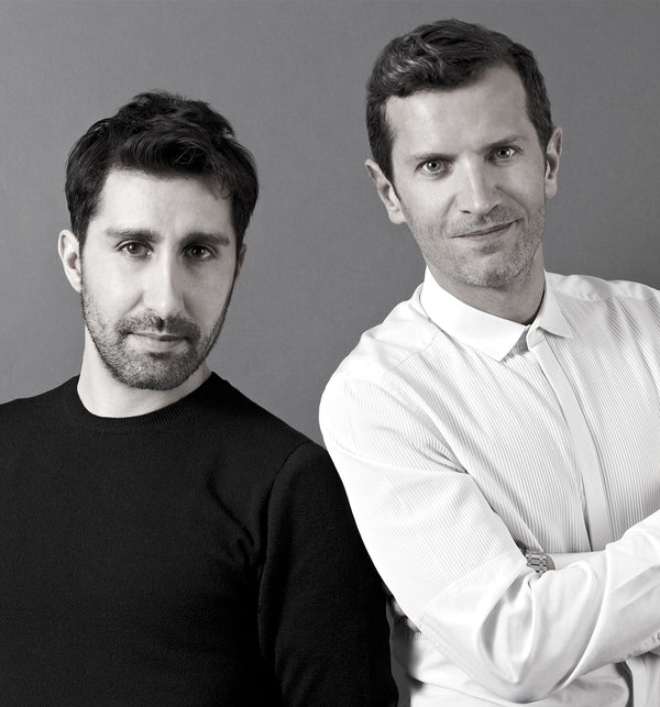 Founder and Creative Director Elad Yifrach with house nose Jann in a black and white portrait.