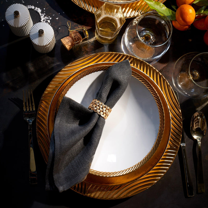 Dinnerware setting with corde gold pattern, black napin, gold Braid motif napkin ring