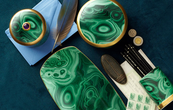Desktop with green-glazed porcleain candle, round box, rectangular tray and pencil cup resembling Malachite stone banded pattern.