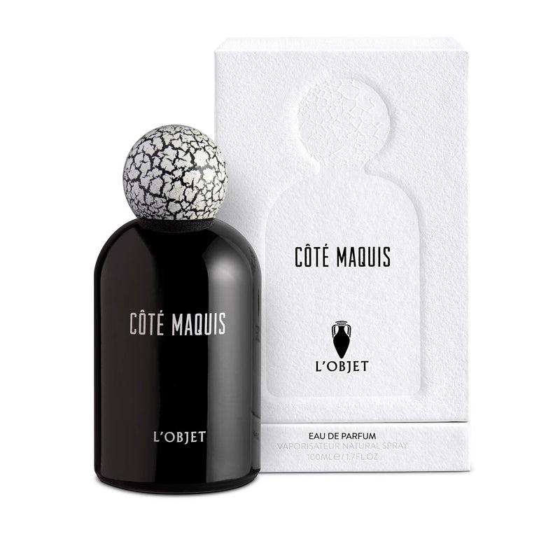 black bell shaped glass bottle topped with a round crackle top in front of a white paper matte packaging box