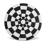 Black and white checkerboard glaze pattern on a low, rimless porcelain platter.
