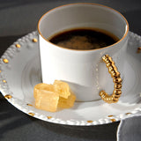 Haas Mojave Espresso Cup and Saucer in Gold Features Bold Artistry - Reminiscent of Desert Pebbles - Definitive Patterns and Versatile Style