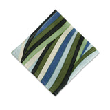 Linen napkins with an organic, undulating pattern in blue, green and ivory hues.