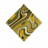 Linen napkins with an organic, psychedelic pattern in muted green, yellow, brown and ivory hues.