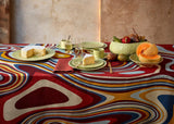 Table set with linen sateen waves multi-colored tablecloth and matcha green Haas Brother dinnerware
