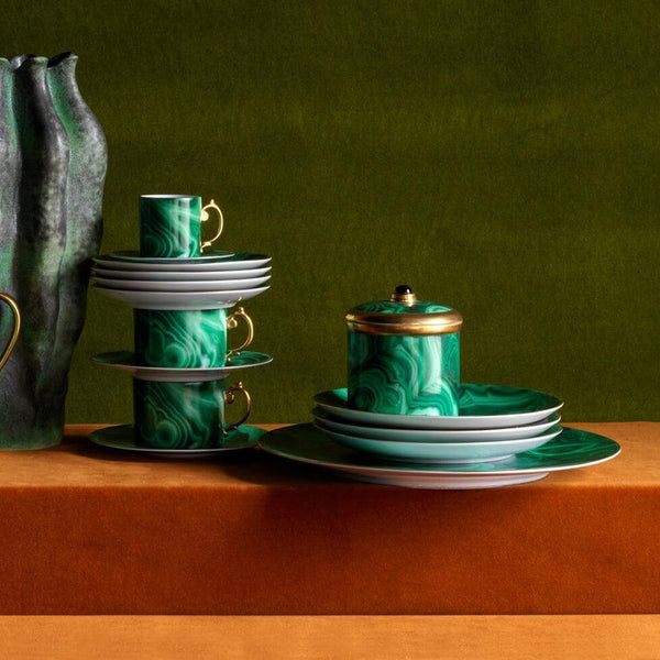 Group of L'Objet decorative objects including Malachite pattern candle, drinkware, cenote vase