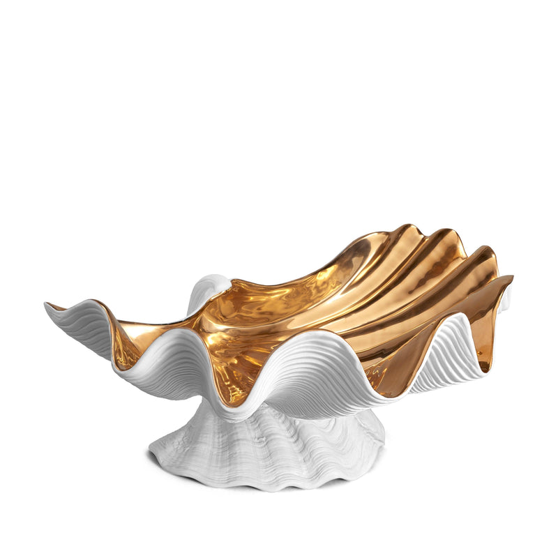 Neptune Bowl - X-Large. White porcelain shell-shaped bowl with gold interior floating on a base. 