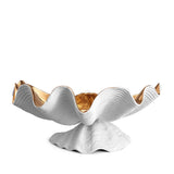 Neptune Bowl - X-Large. White porcelain shell-shaped bowl with gold interior floating on a base. 