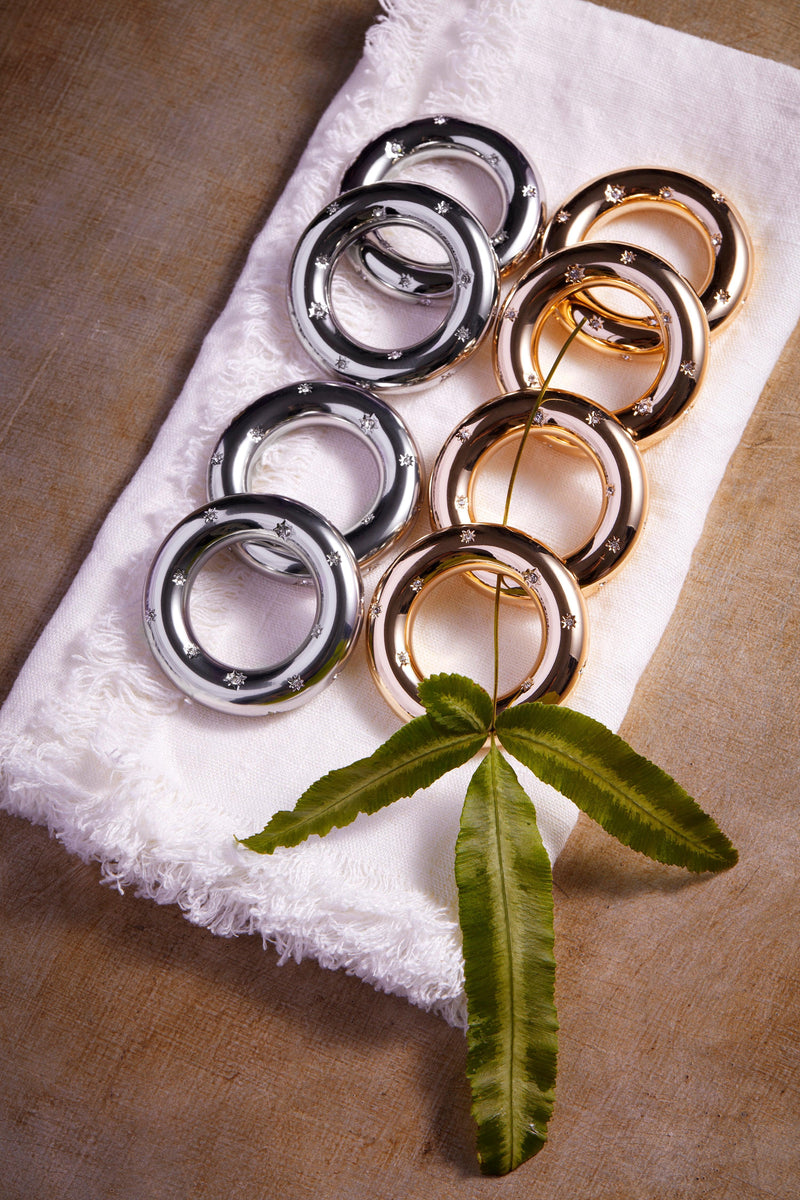 Gold and platinum napkin rings embellished with crystal star motif