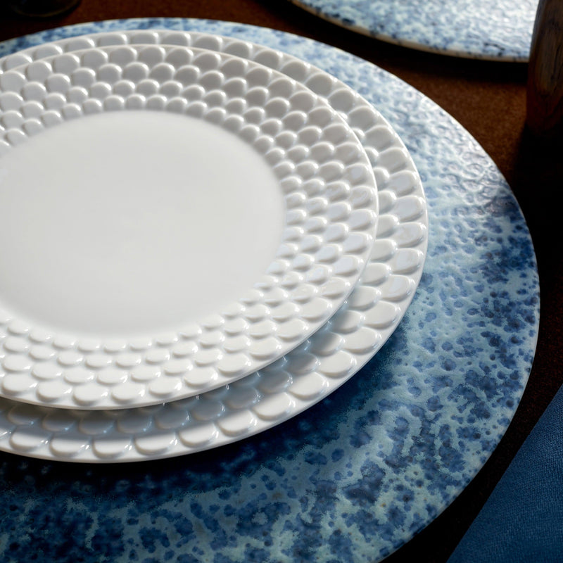 Blue round placemat set with white aegean waves pattern dinnerware